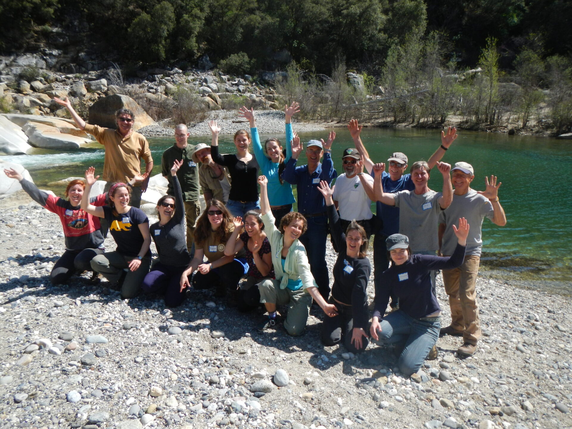 20 SYRCL restoration volunteers celebrate by the beautiful South Yuba River at Hoyt's Crossing